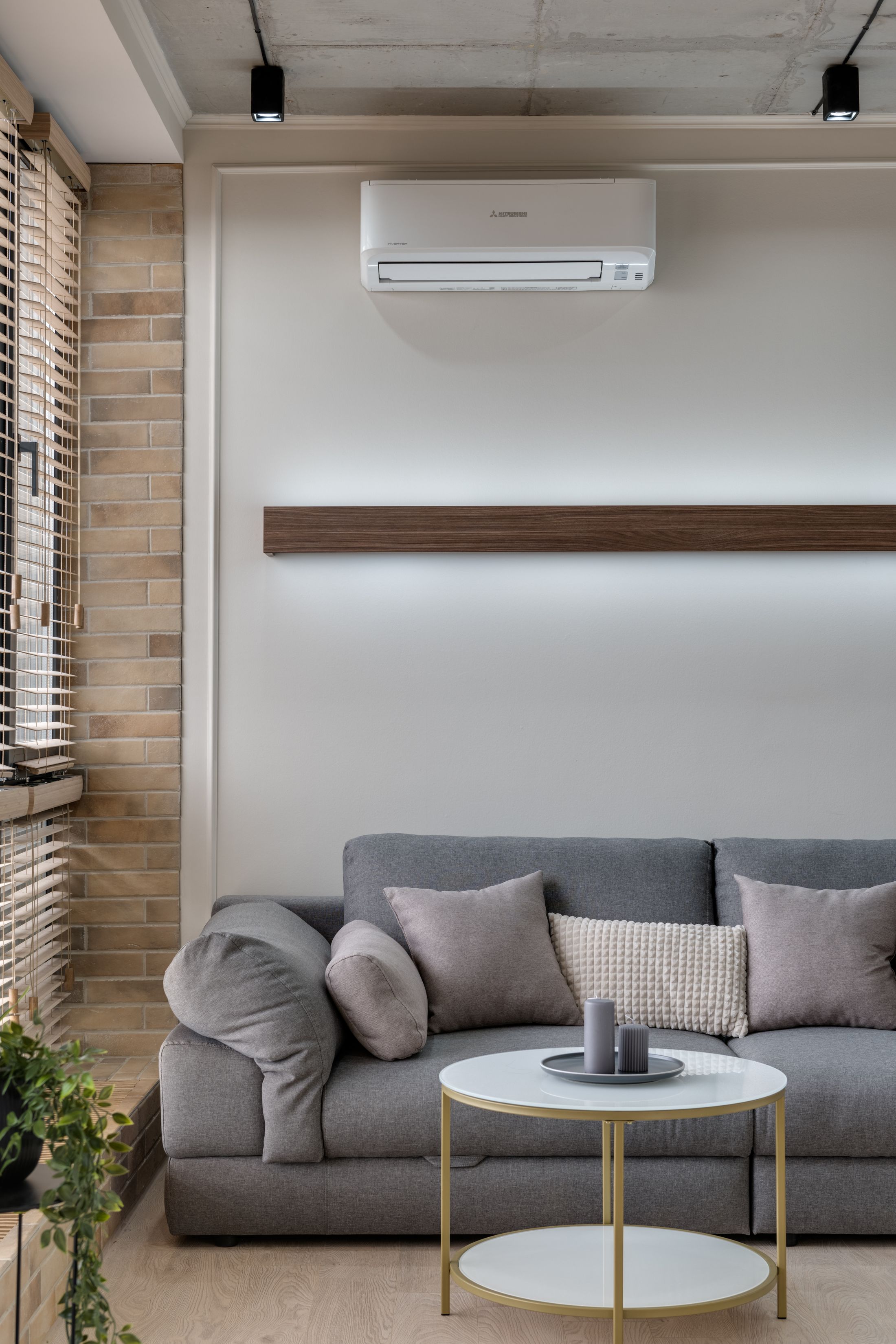 Stylish sofa room with air conditioning above the lounge area